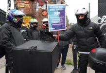 Deliveroo riders from the Independent Workers’ Union of Great Britain in Shoreditch High Street, east London, as they go on strike