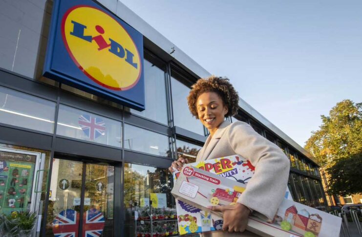 Customer donating toys to Lidl for Toy Bank Campaign