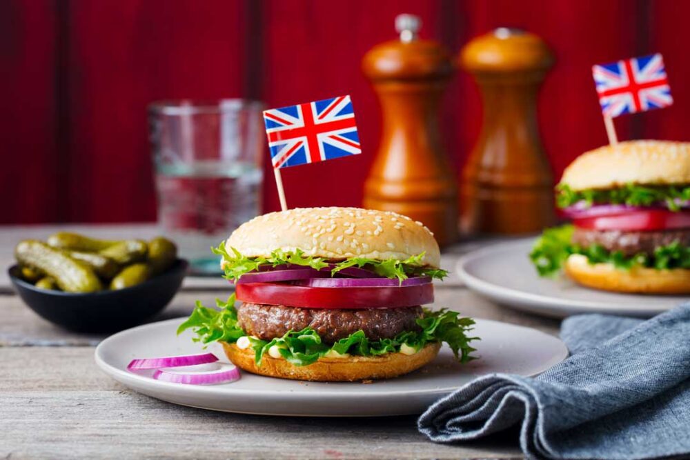 burger with british flag on top wooden background 2021 08 26 16 29 53 utc