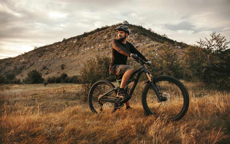 active man riding electric mountain bike in nature 2022 11 23 00 45 29 utc