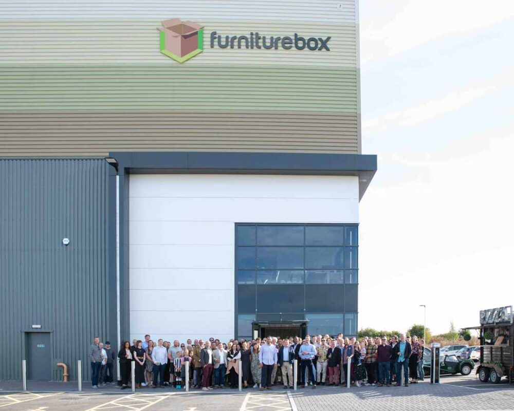 Furniturebox team of 53 staff with founders Dan Beckles and Monty George at the front outside the new 88000 sq ft warehouse and HQ next to the M4 at Chippenham copy 2