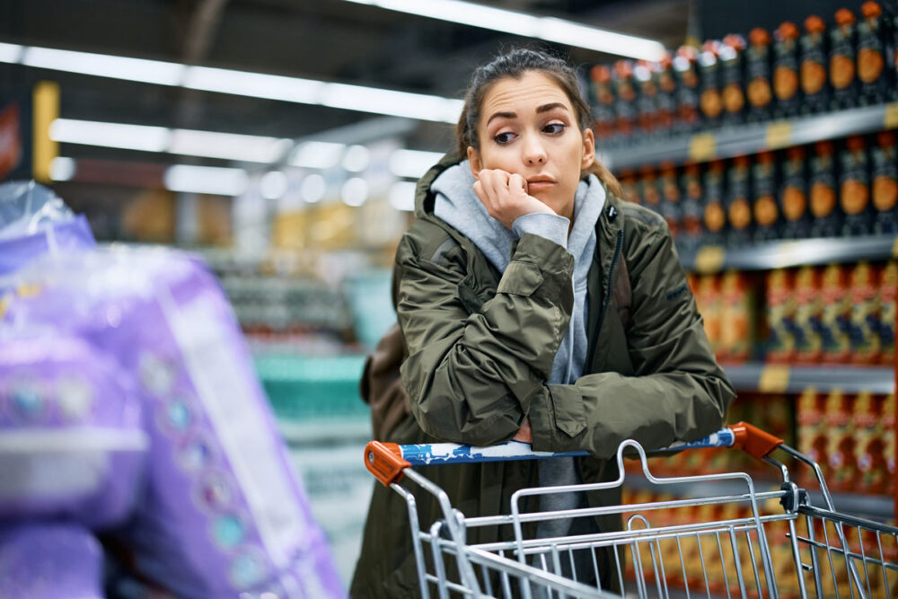 young worried woman looking at rising prices while 2023 11 27 05 10 26 utc