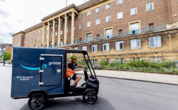 New electric cargo bike on the road in front of Norwich City Hall. Photography by UNP. Large