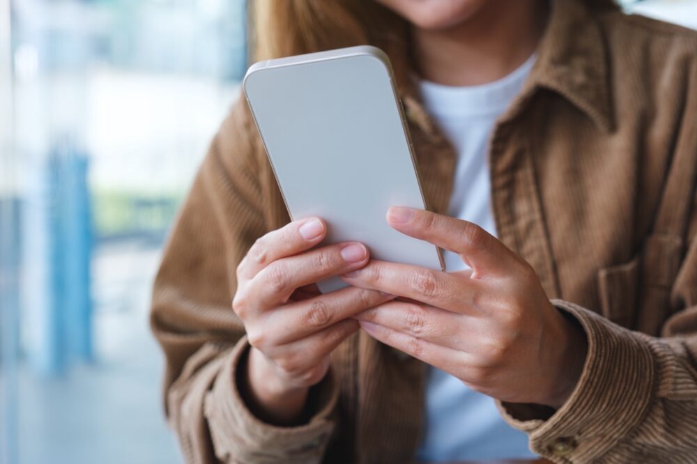 closeup image of a young woman holding and using m 2023 11 27 05 04 22 utc Large