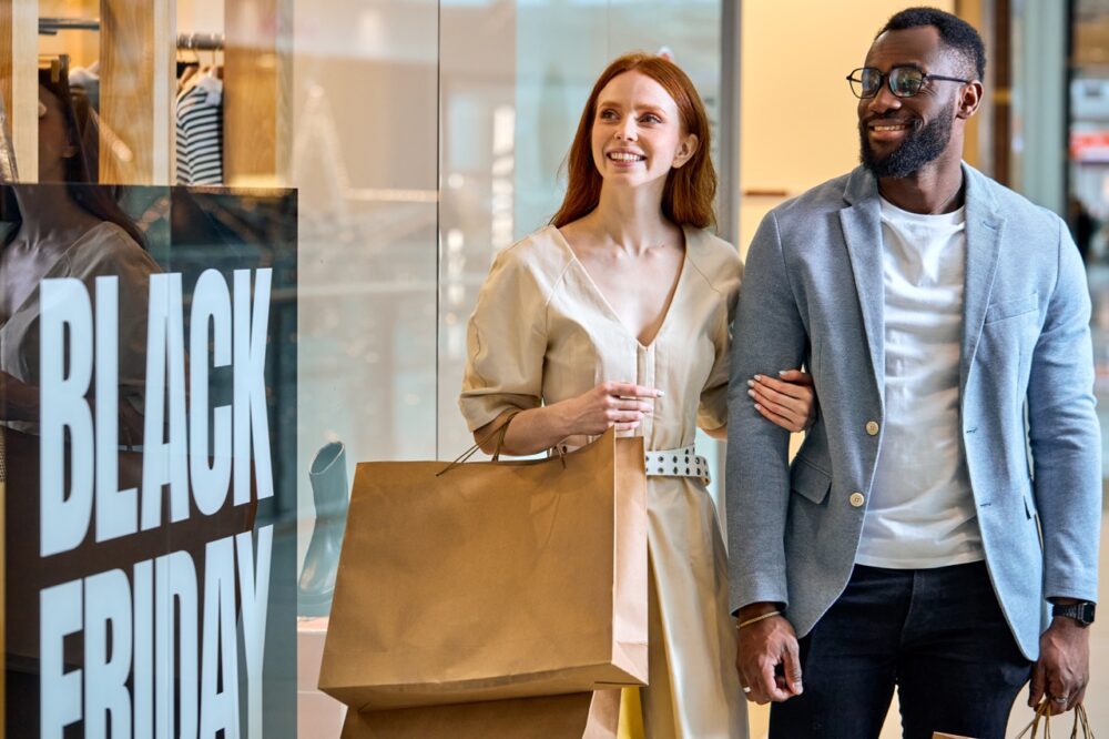 joyful diverse couple taking part in black friday 2024 05 10 23 49 36 utc Large