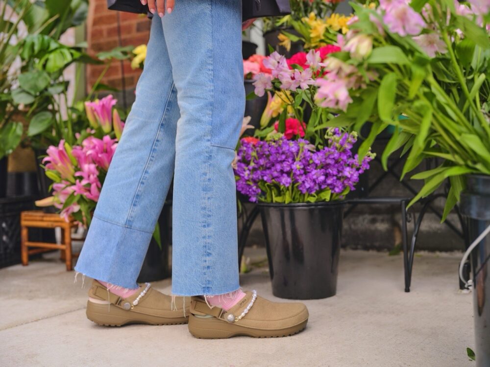 Person Wearing Crocs Shoes