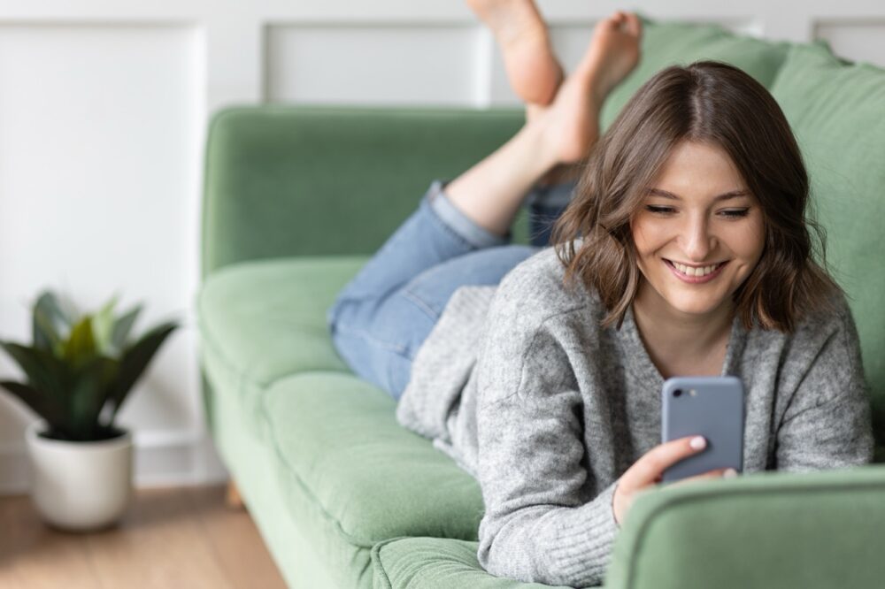 young beautiful smiling woman using cell phone lyi 2026 01 06 00 52 45 utc Large