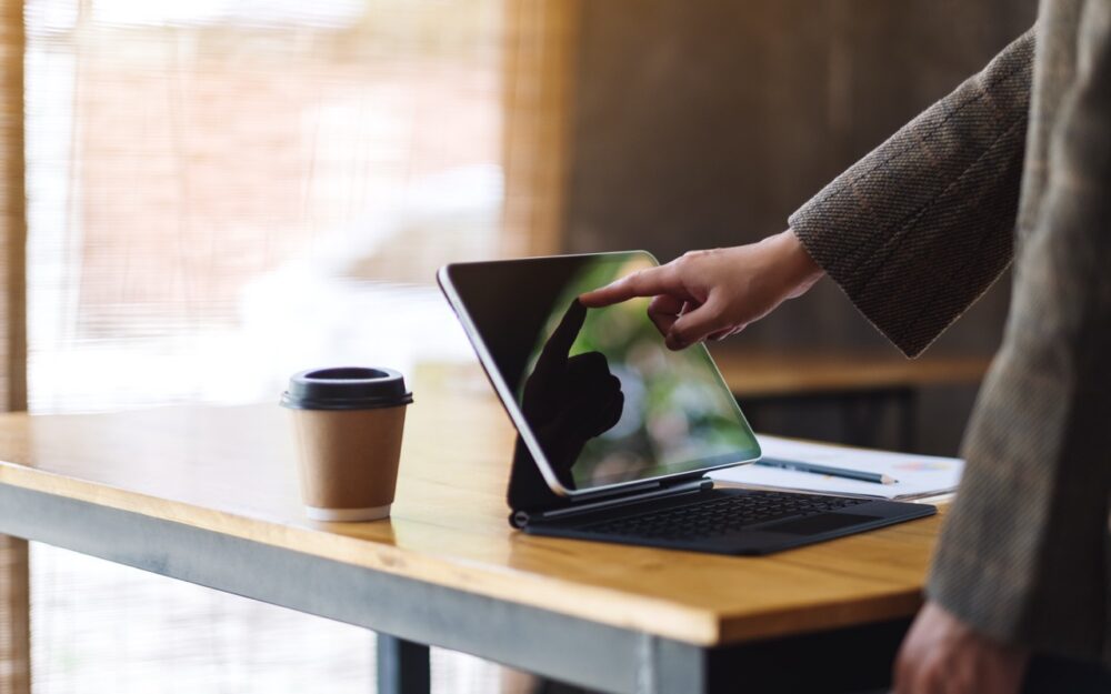 digital workplace adult using tablet with coffee 2026 01 06 09 23 41 utc Large