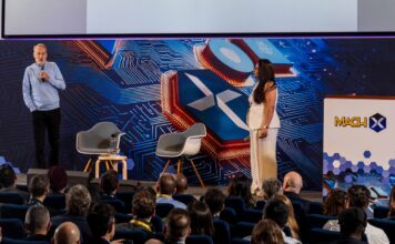 MACH X 2025 Currys Komal Koul EasyJets Paul Curtis on stage Large