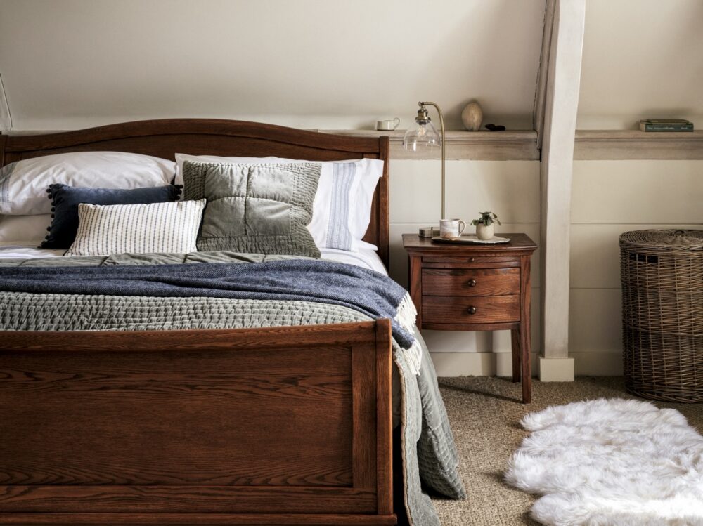 Winchcombe Dark Oak Sleigh Bed and Bedside Table from the Cotswold Company