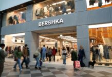 Bershka storefront at Westgate Oxford, with shoppers passing the entrance and clothing displayed in the windows above
