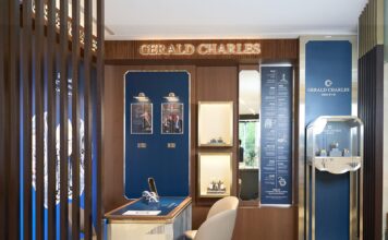Gerald Charles shop-in-shop at Chung Mei Watch's Nanjing store in Taipei, with walnut slatted screens, blue display panels, a consultation desk and illuminated Gerald Charles lettering