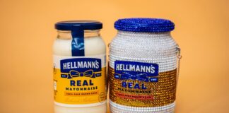 A jar of Hellmann's Real Mayonnaise beside Maya Grisham's crystal-covered handbag in the shape of the jar, with a blue crystal lid and a chain strap, on an orange background