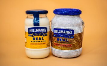 Maya Grisham Turns Hellmann’s Jar Into Crystal Handbag A jar of Hellmann's Real Mayonnaise beside Maya Grisham's crystal-covered handbag in the shape of the jar, with a blue crystal lid and a chain strap, on an orange background