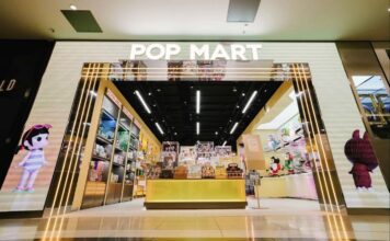 POP MART store entrance with an illuminated archway and character artwork
