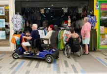 Hoist Training for Mobility Retail Staff People in wheelchairs and mobility scooters outside shop