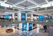 Primark store frontage across two levels of the Doha Festival City atrium, with illuminated Primark signage in English and Arabic