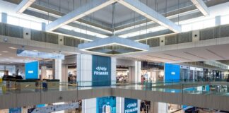 Primark store frontage across two levels of the Doha Festival City atrium, with illuminated Primark signage in English and Arabic