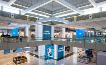 Primark store frontage across two levels of the Doha Festival City atrium, with illuminated Primark signage in English and Arabic
