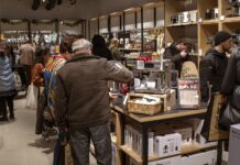 Shoppers browsing coffee machines, cookware and kitchen utensils inside a ProCook store