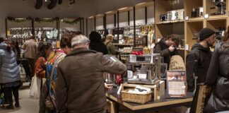 Shoppers browsing coffee machines, cookware and kitchen utensils inside a ProCook store