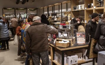 Shoppers browsing coffee machines, cookware and kitchen utensils inside a ProCook store