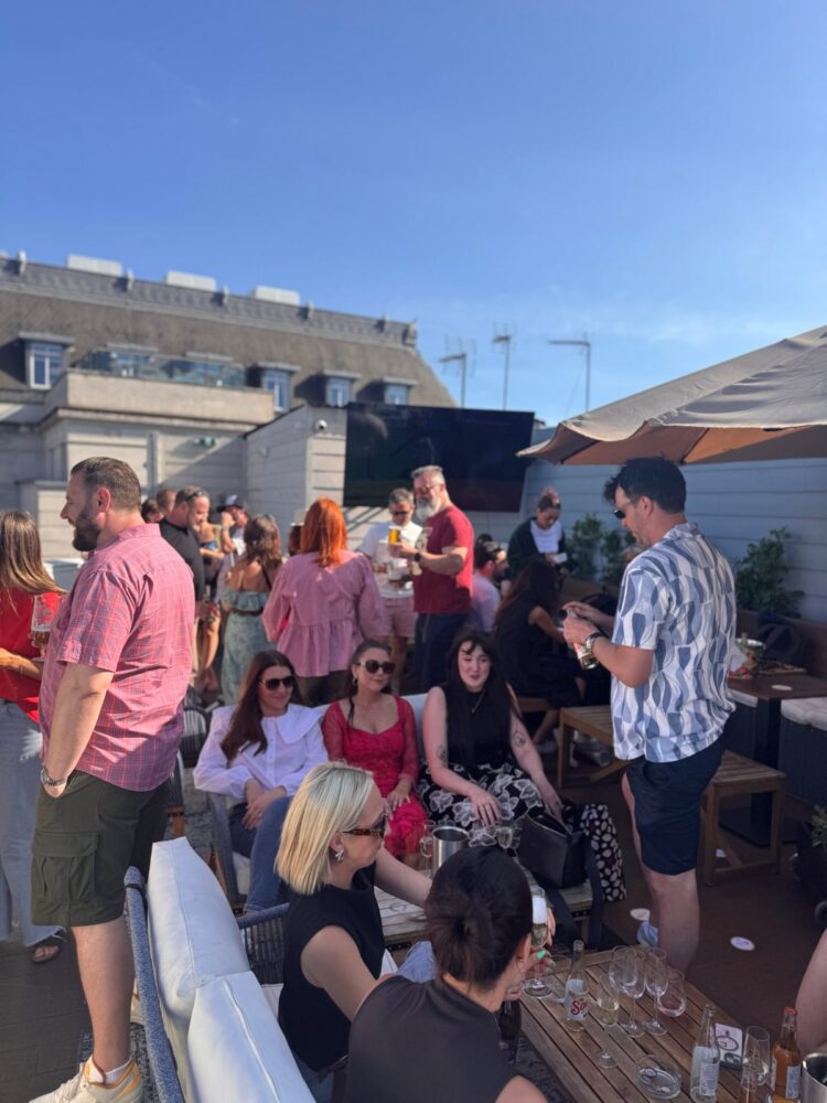 Guests on the rooftop terrace at the SDEA Summer Social, July 2026
