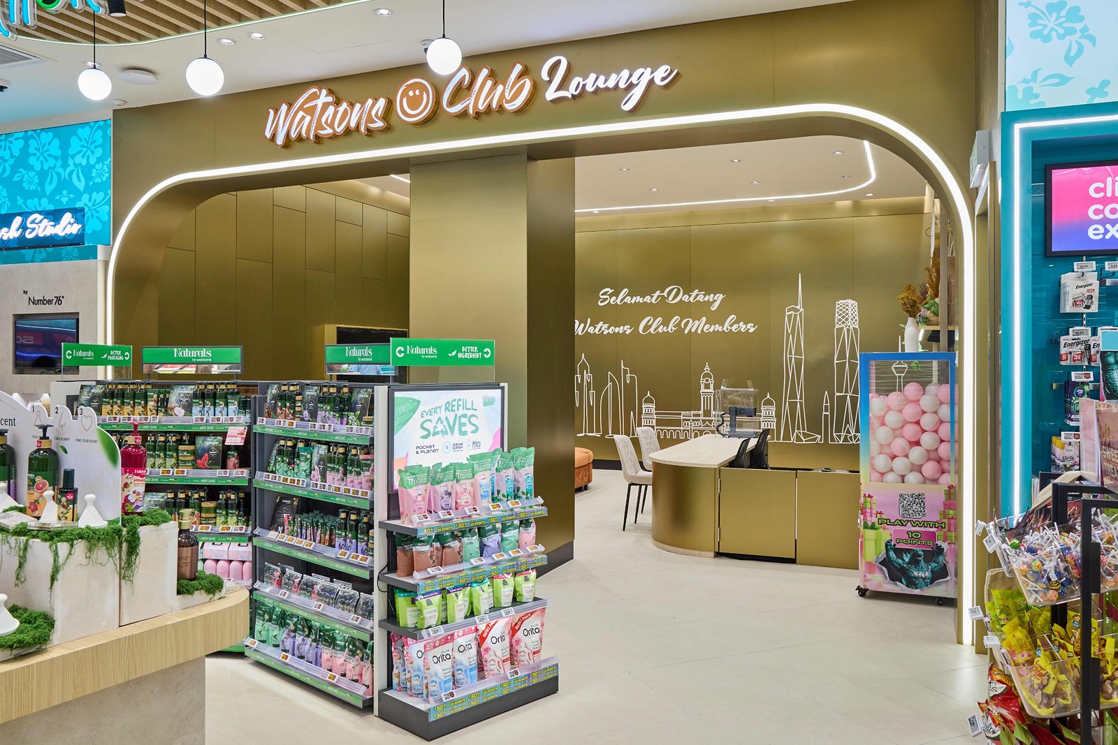 Entrance to the Watsons Club Lounge at Watsons Plus, with a Kuala Lumpur skyline mural and Selamat Datang Watsons Club Members lettering