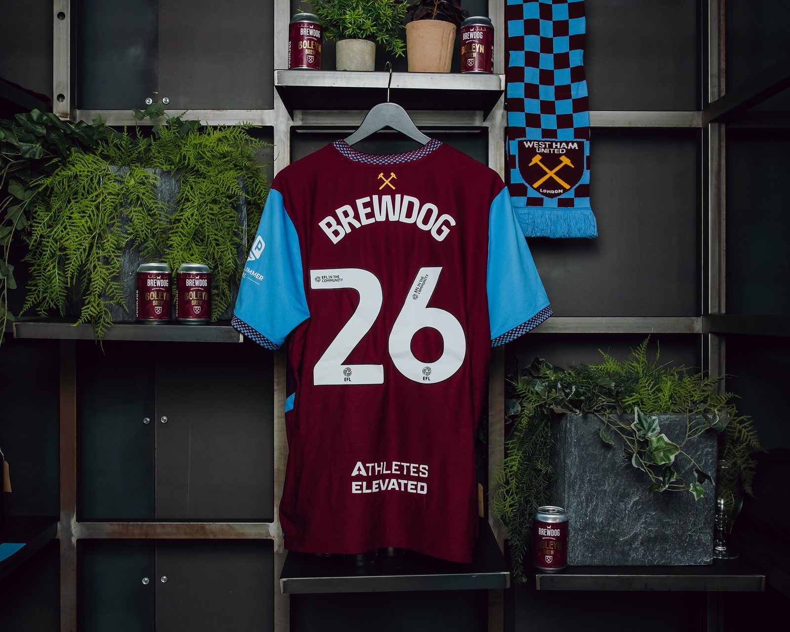 West Ham United shirt printed with BrewDog and the number 26, displayed with cans of Boleyn Brew and a West Ham United scarf